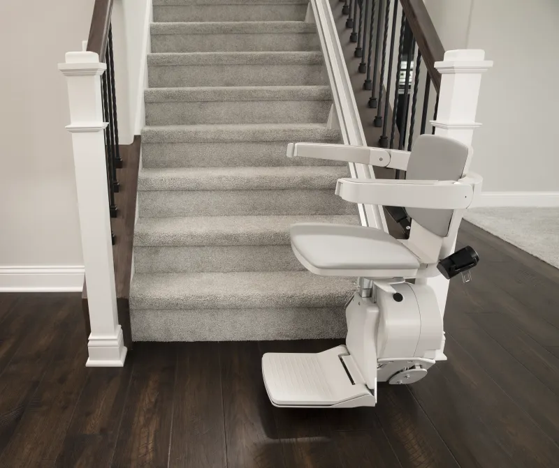 /content/image/Products/Stairlifts/Bruno Elan Stairlift/bruno-elan-bottom-of-stairs-from-side.webp